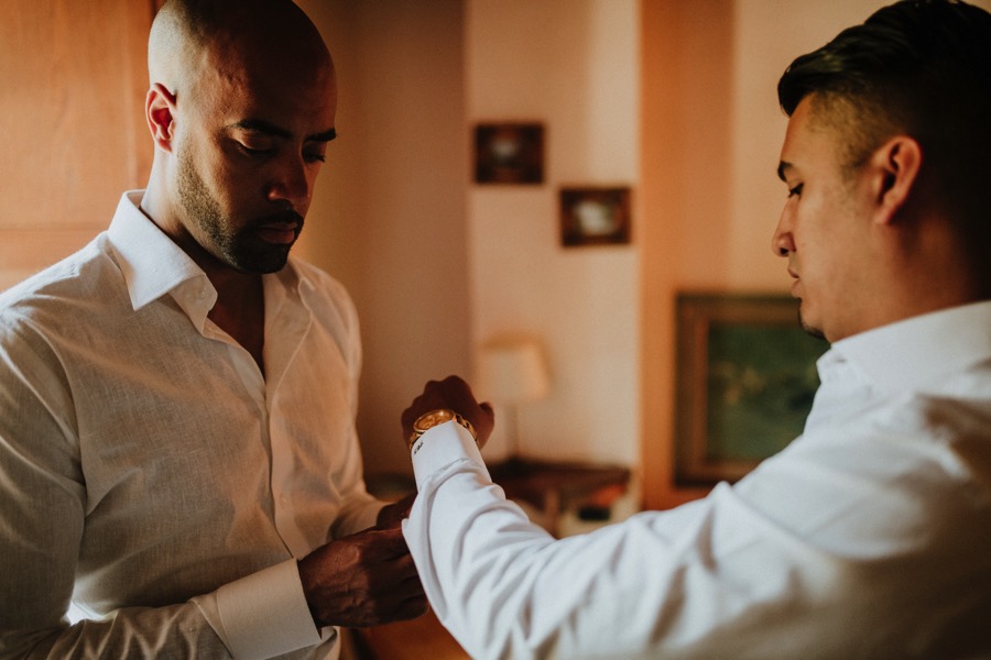 groom gets ready with the best man