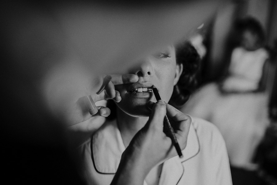 detail of lips make up during bride getting ready