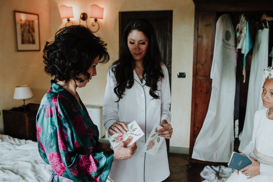Bride giving handkerchiefs to her mother