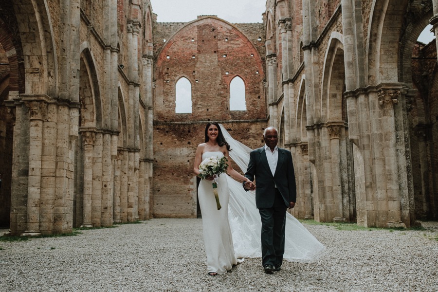 bride with father walking in San Galgano