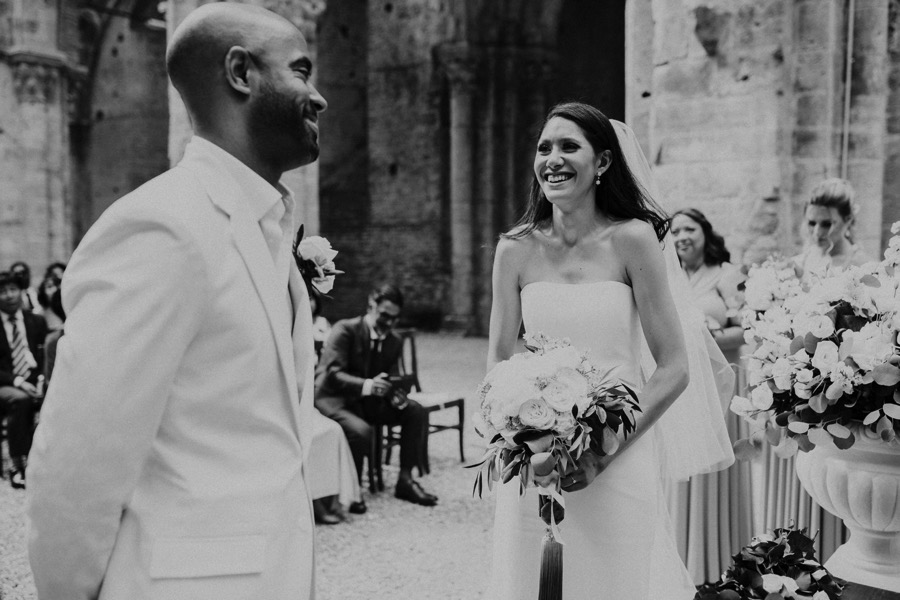 black and white bride and groom smiling