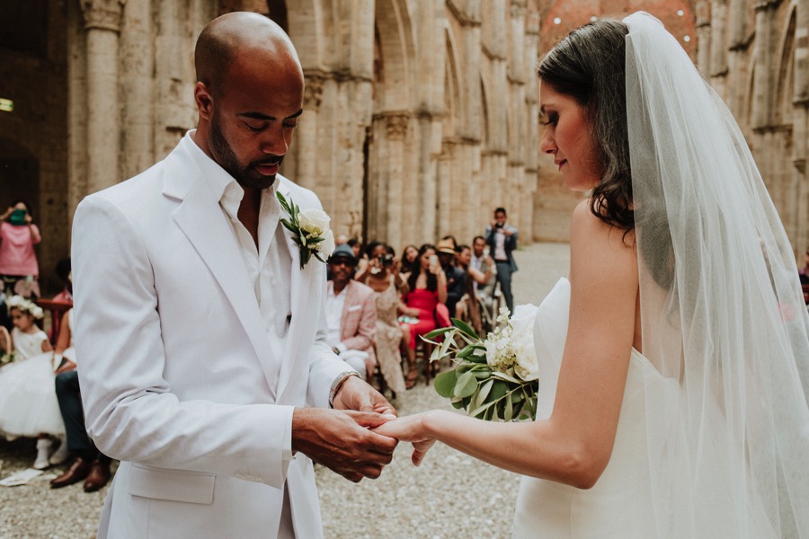 groom putting ring in San Galgano