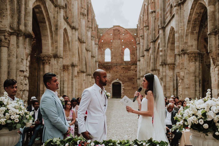 bride speaking to groom in San Galgano