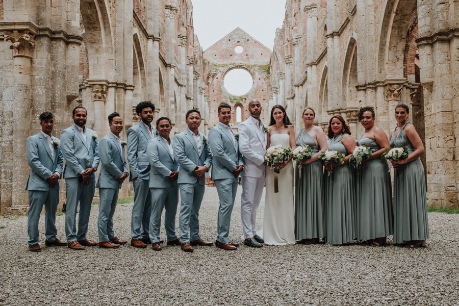bride and groom with best men and bridesmaids in San Galgano