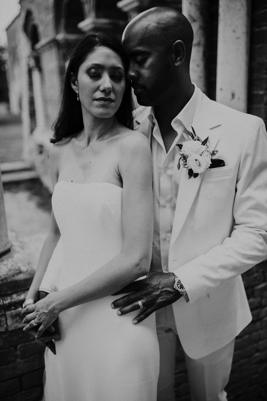 newlyweds wearing white dresses natural light