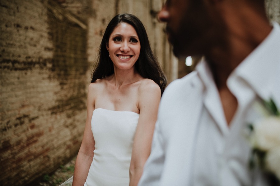 natural portrait of a bride looking at groom in San galgano