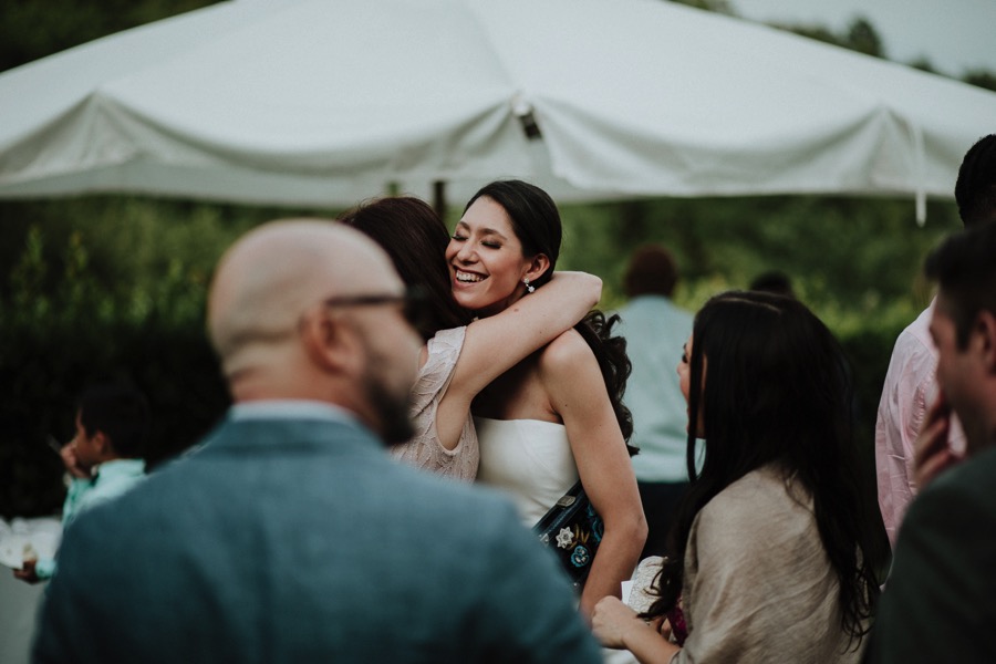 bride greeting guests at reception
