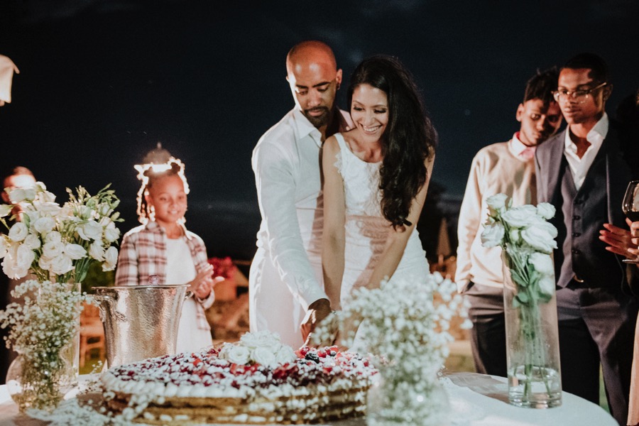 bride and groom cutting layered pancake wedding cake