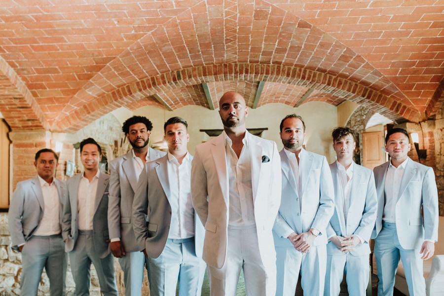 group picture of best men and groom in the middle