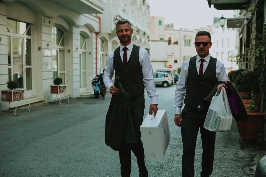 Groom and best man walking down the streets of amalfi