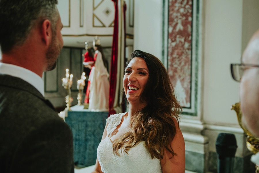 smiling bride in Santa Trofimena Amalfi looking at the groom