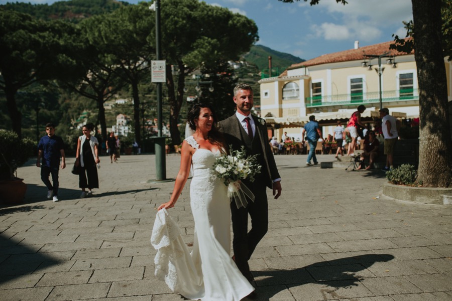 Bride and groom walking in the streets of Ravello during their destination wedding