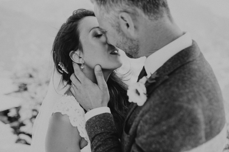 Close up of bride and groom newlywed kissing in black and white in Ravello