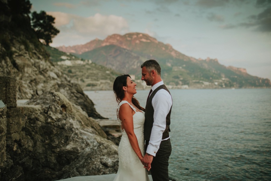 portrait of Bride and groom looking at each other in Hotel Marmorata by the seaside