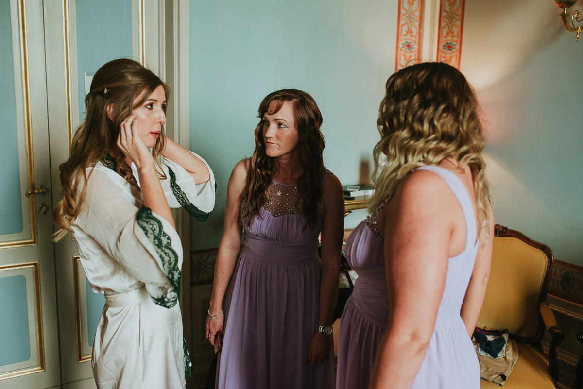 bride and bridesmaids talking before getting ready for the wedding