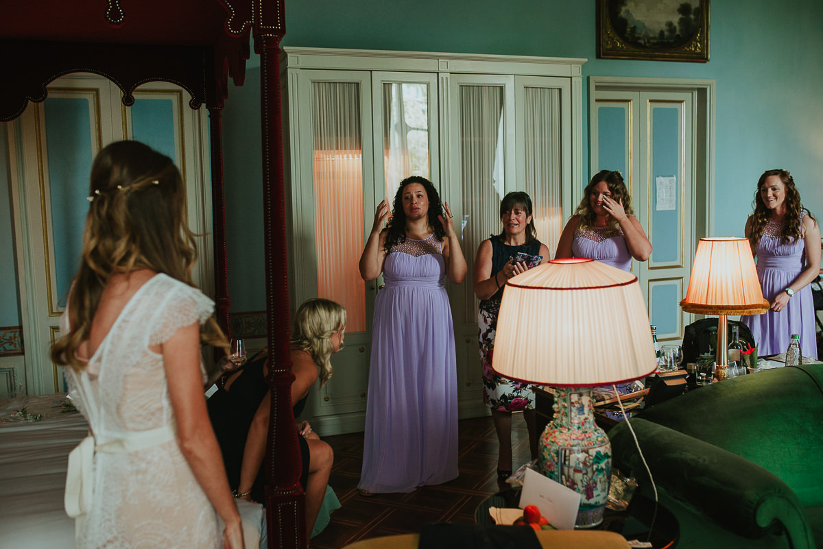 bridesmaids crying for the first look at the bride