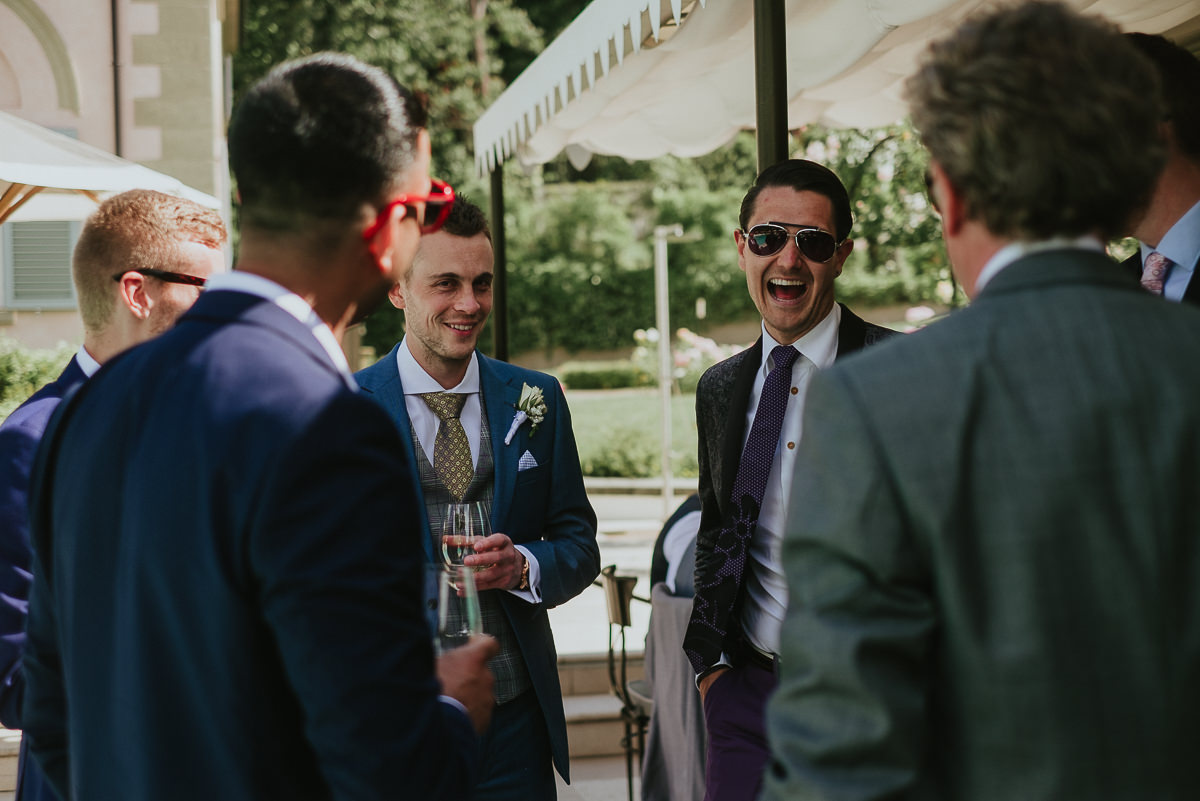 groom and best men having a drink before wedding