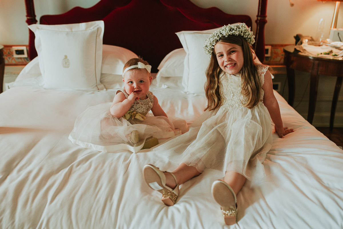 portrait of two children ready to be flower girl