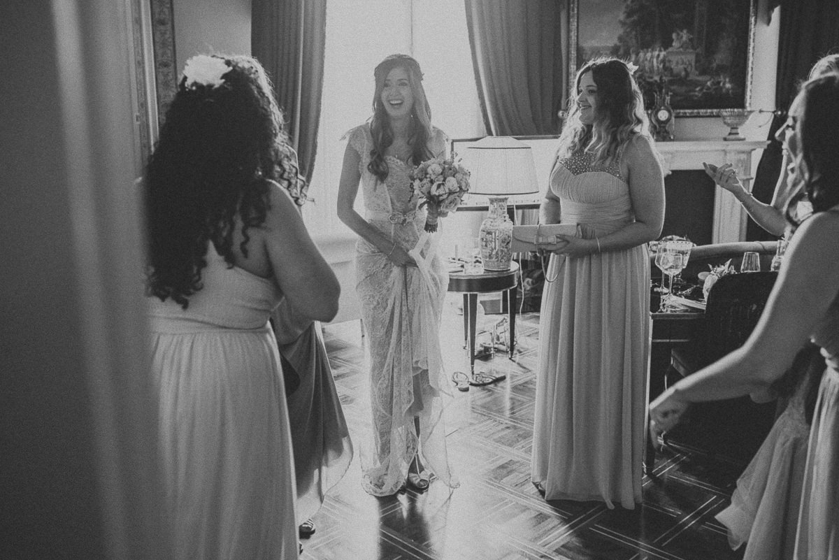 bride smiling excited to leave the room before wedding