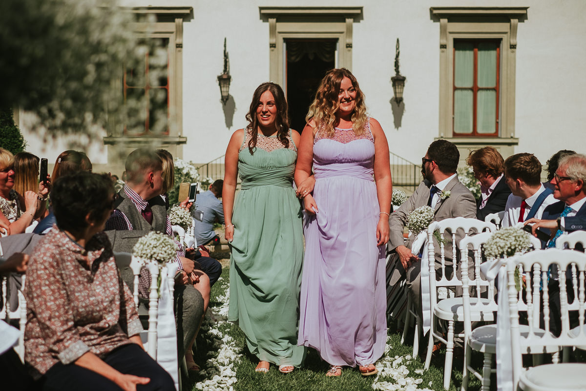 bridesmaids wearing lilac and green dresses in Villa Cora