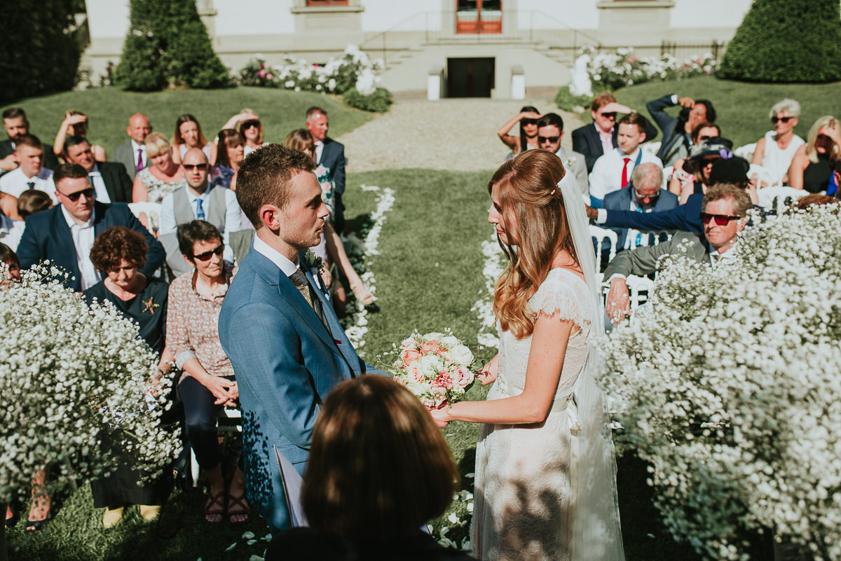 bride and groom wedding promises in Villa Cora lawn garden