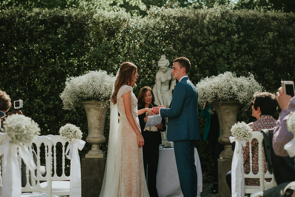 bride and groom promises during a wedding in Florence Villa Cora