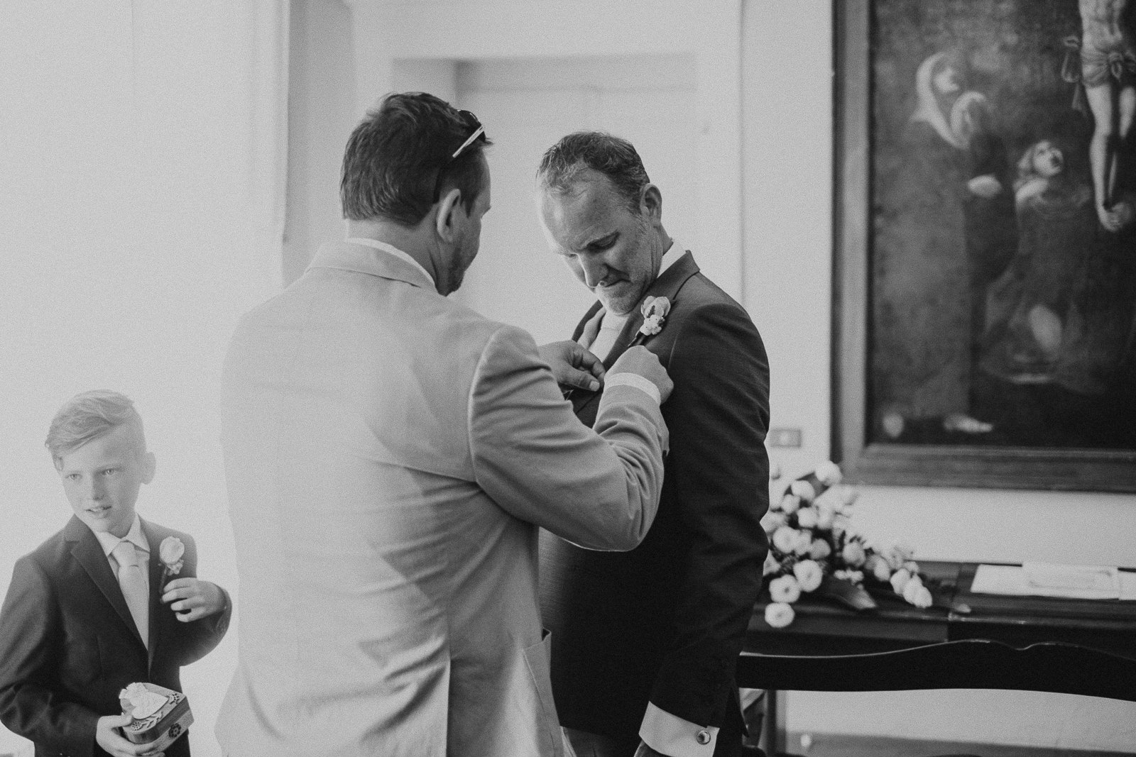 groom adjusting final details before wedding