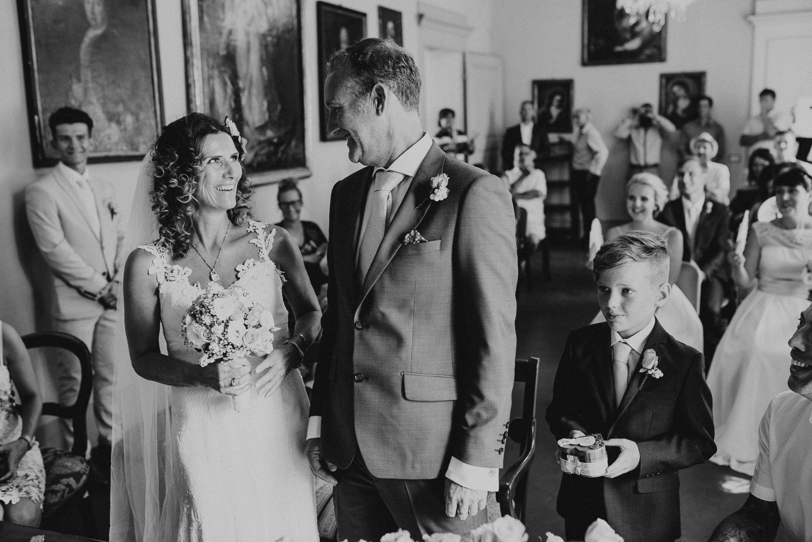 black and white portrait of bride and groom looking at each other