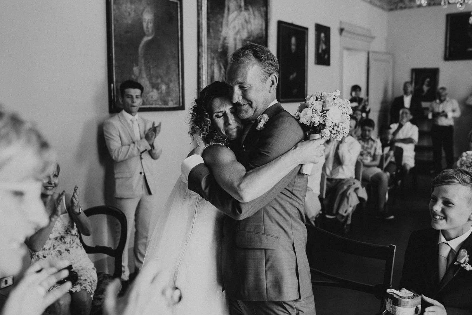 bride and groom hug each other right after saying I do