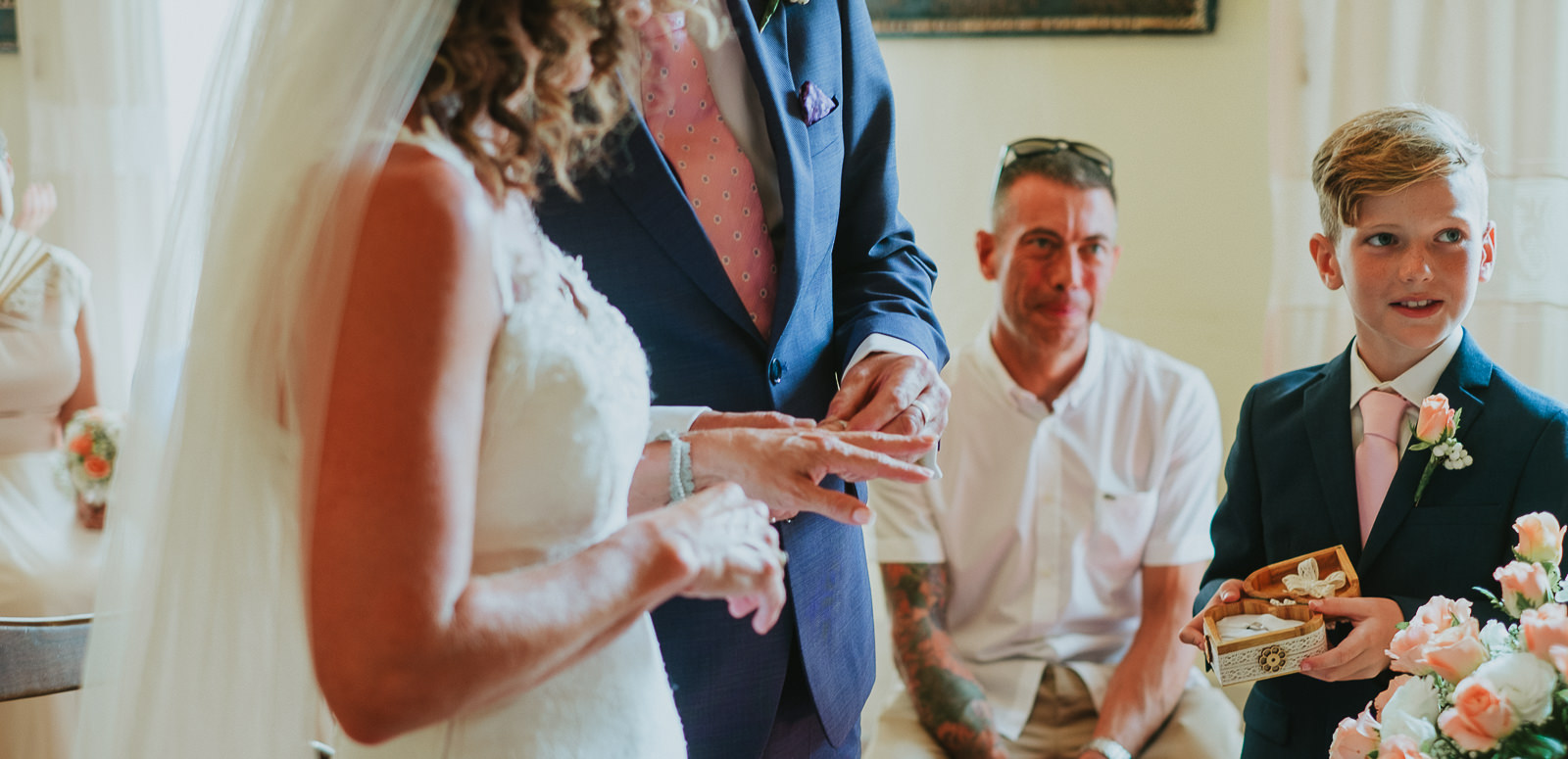 hand details during the exchange of wedding rings