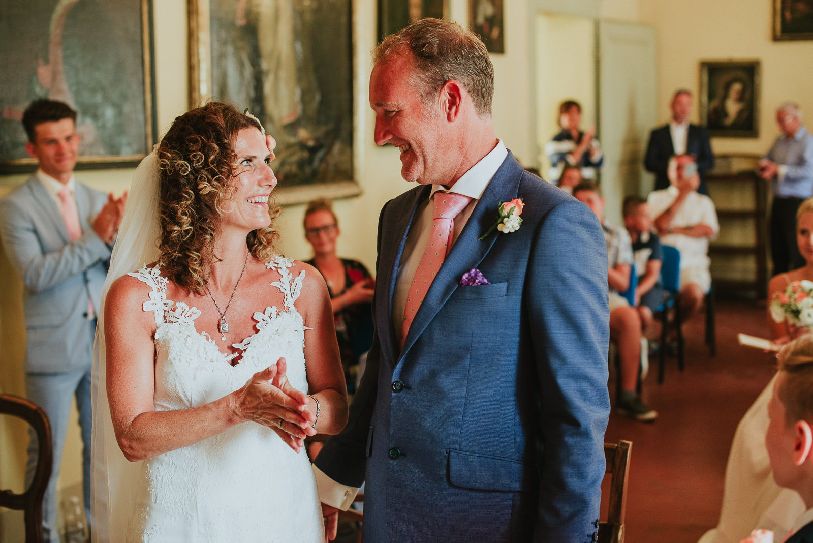 Bride and groom looking at each other and smiling