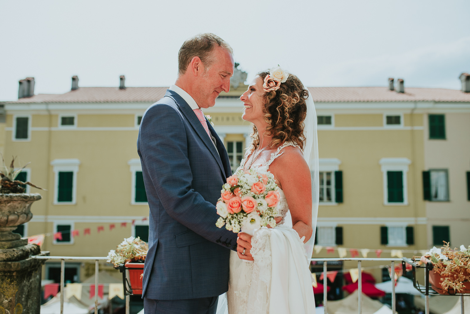 Bride and groom portrait in the terrace of Pontremoli Town hall