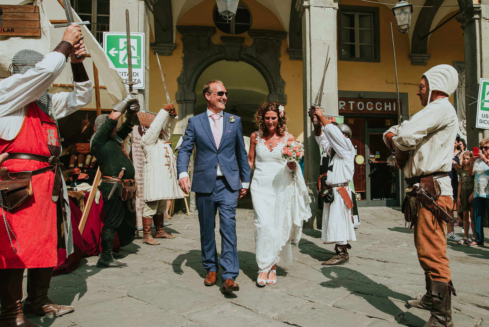 Bride and groom walking down the aisle in Pontremoli