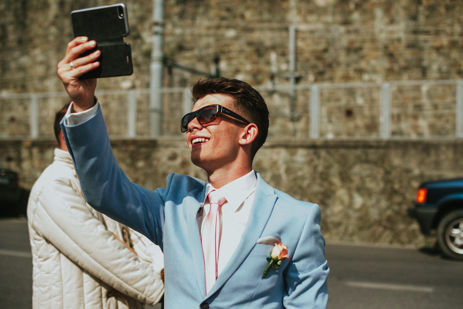 Best Man taking pictures at the newlywed couple