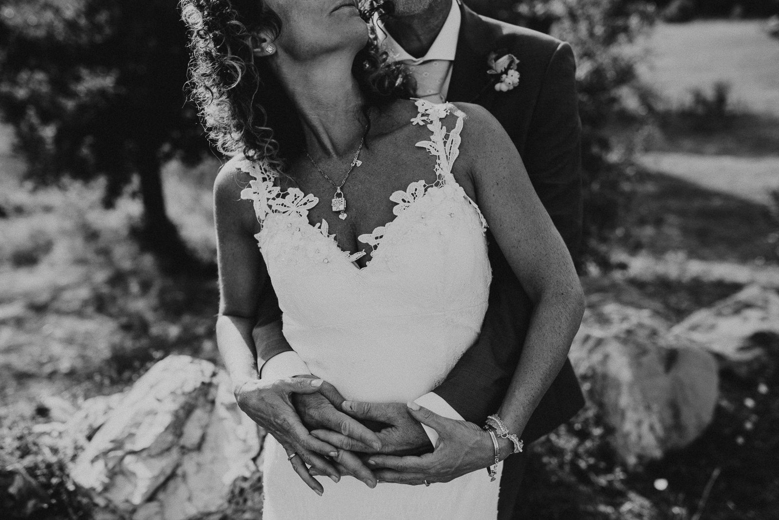 black and white portrait of bride and groom focused on hands
