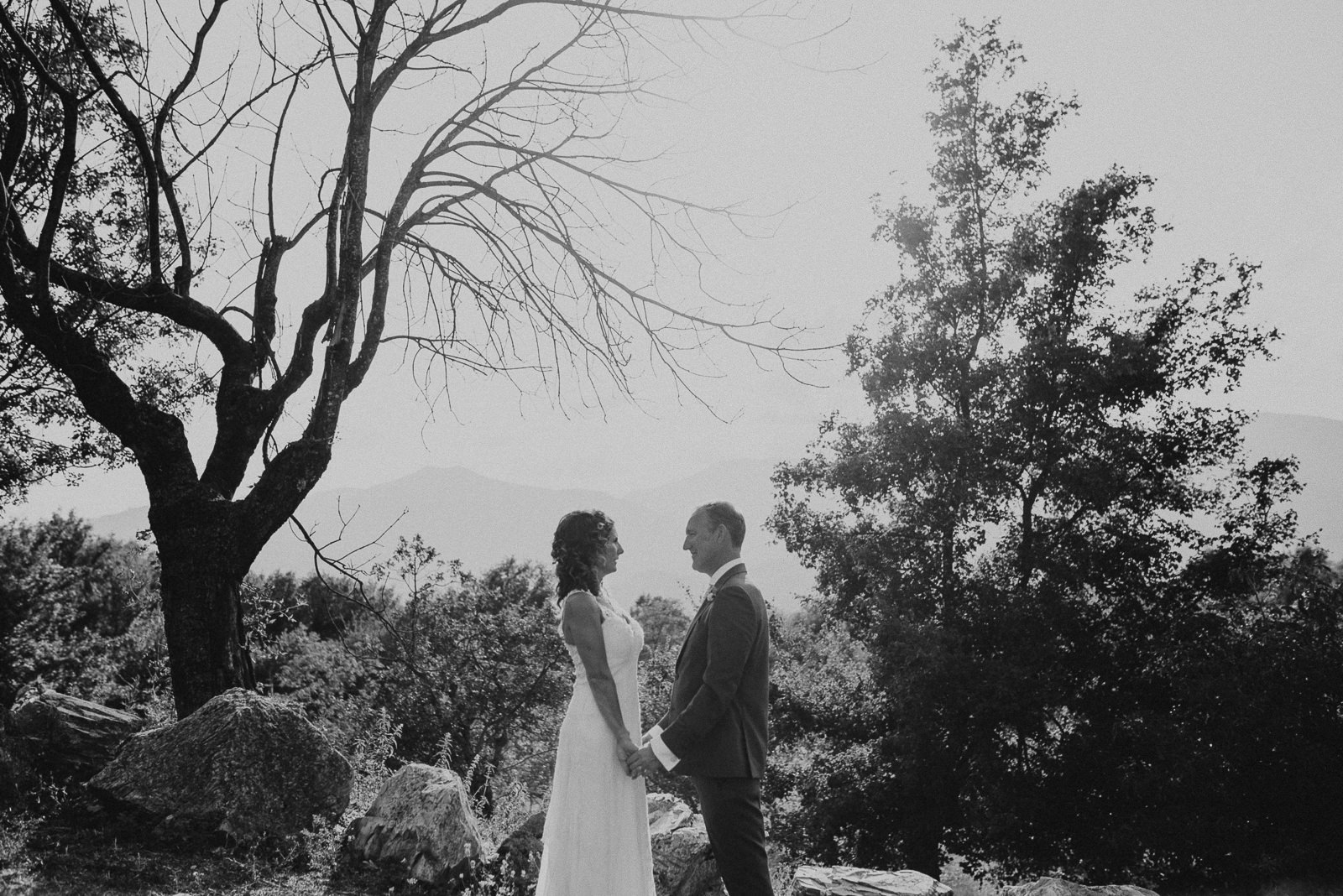 black and white portrait of bride and groom among the Tuscan landscape