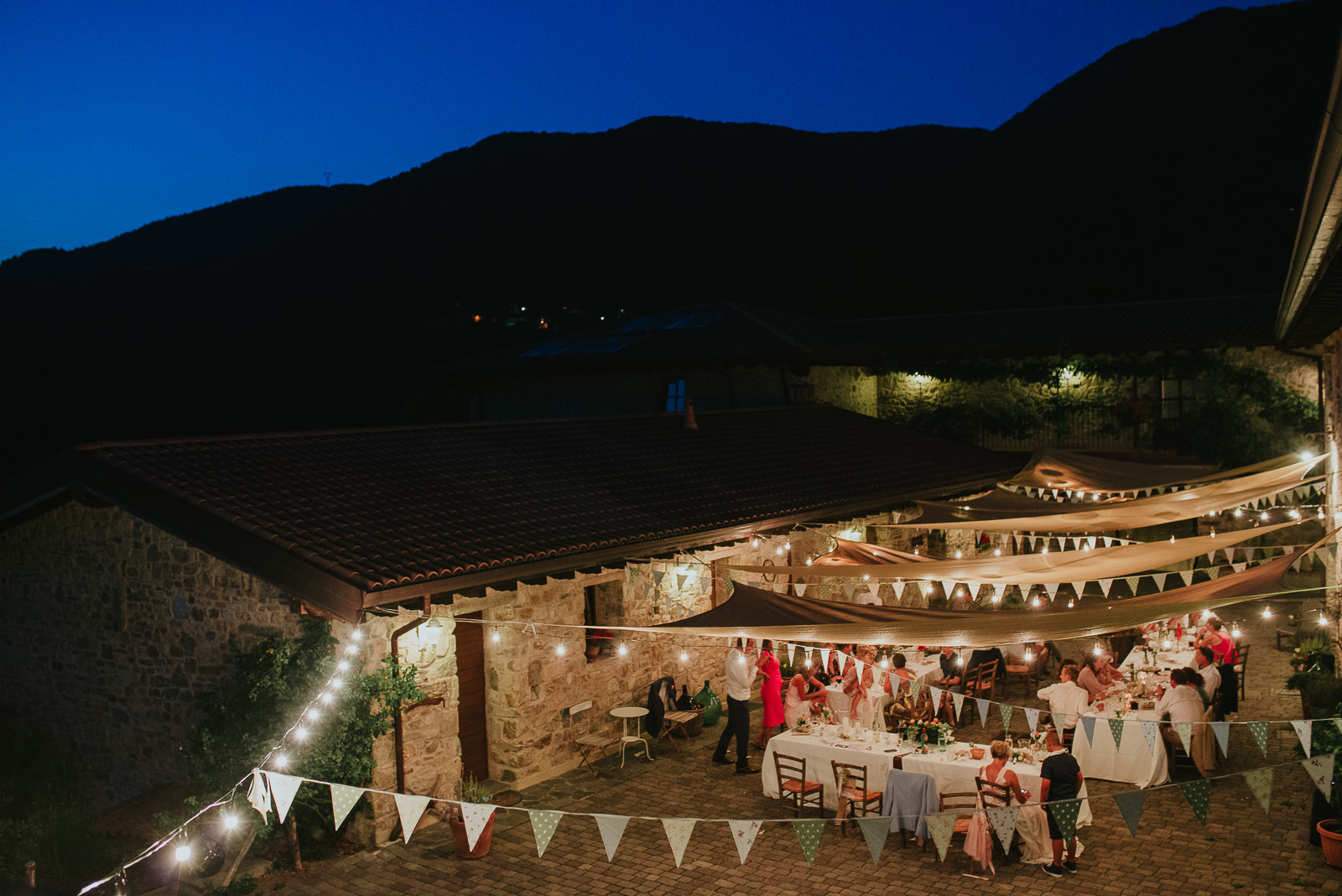 Podere Conti by night during an outdoor destination wedding