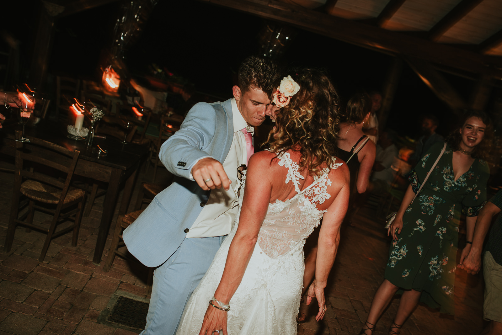 bride dancing during wedding party in Podere Conti