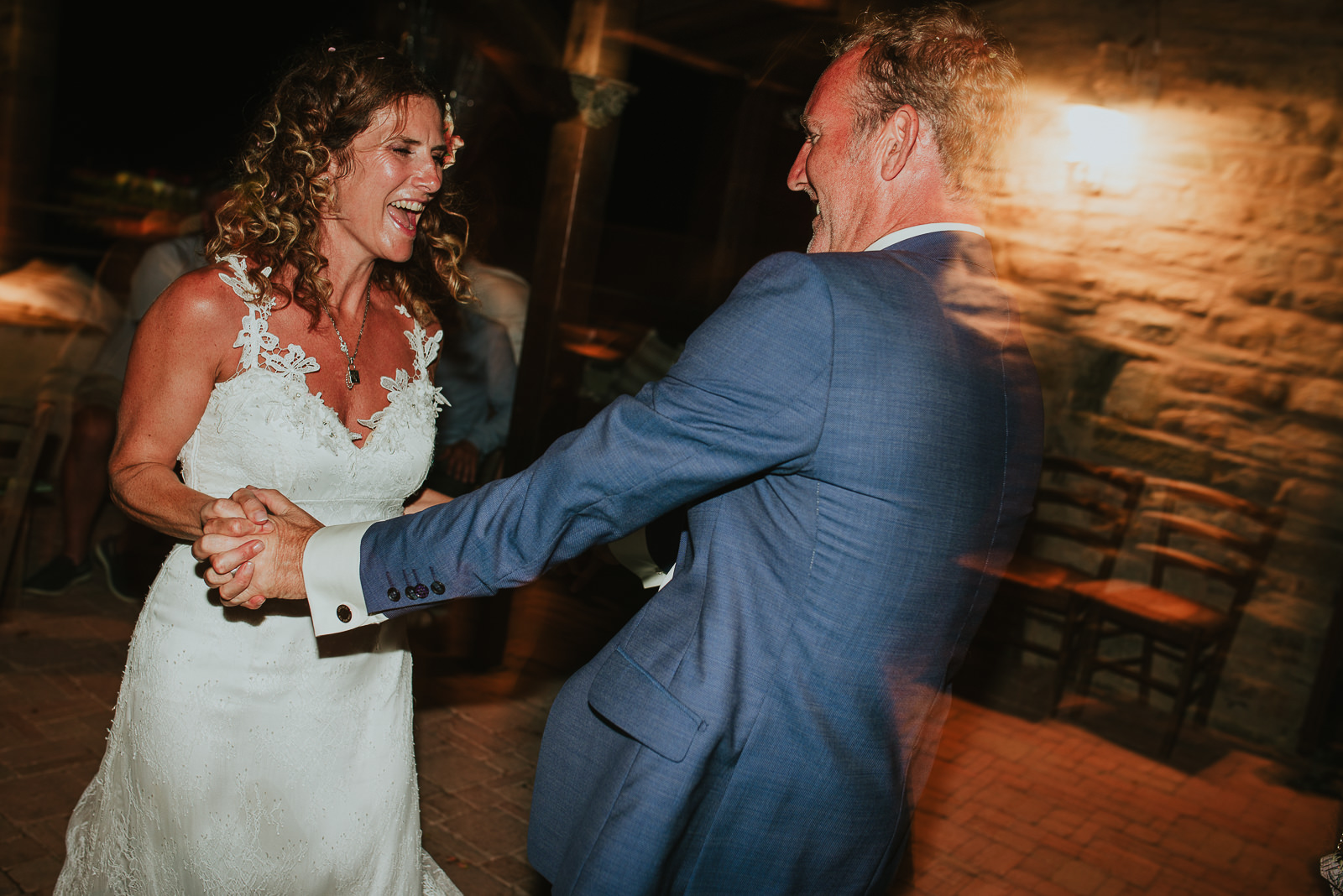bride and groom dancing in Podere Conti during a destination wedding party