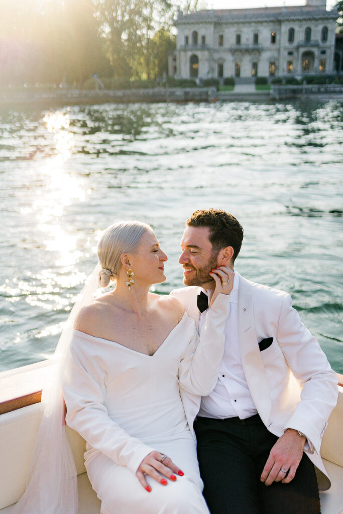 bride and groom on boat after Lake Como wedding